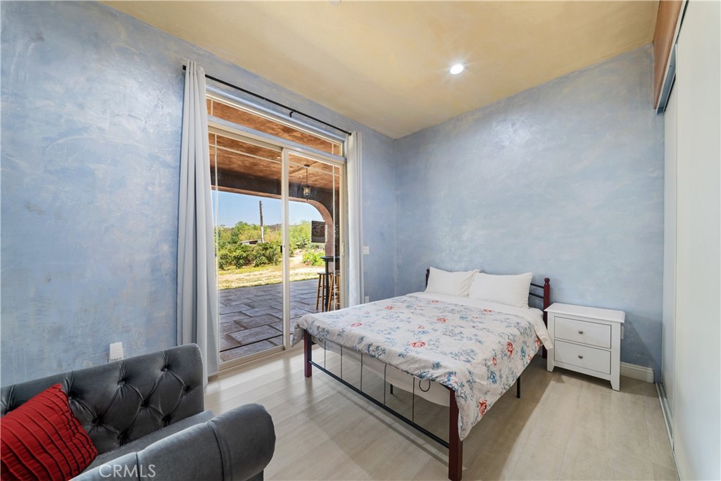 12605 Kagel Canyon Road Sylmar, CA 91342 - Photo 20 of 61 a bedroom with a bed couch and a window