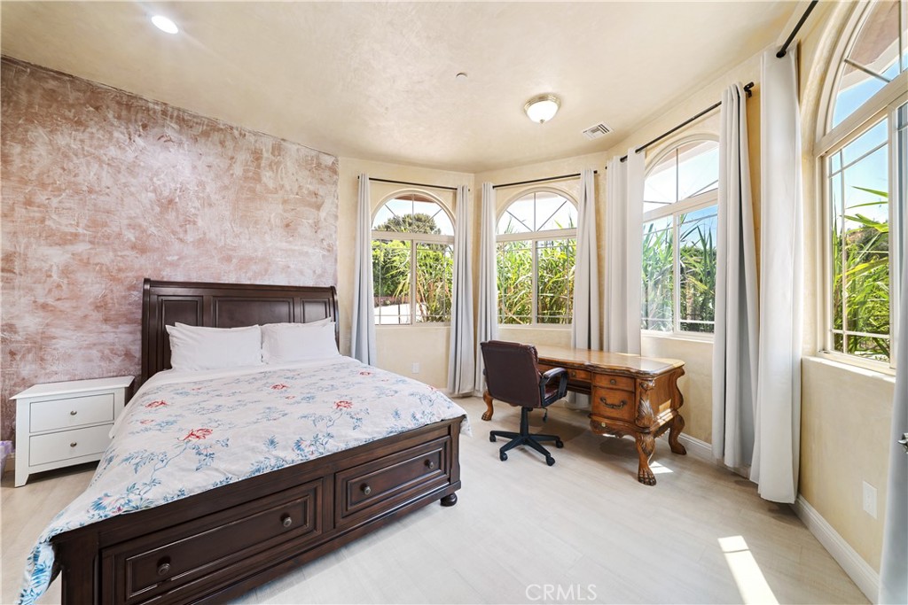 12605 Kagel Canyon Road Sylmar, CA 91342 - Photo 21 of 61 a bedroom with a bed and a lounge chair