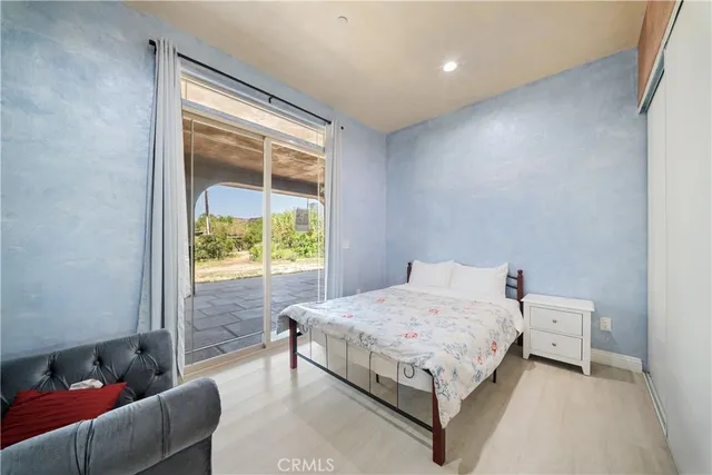 a bedroom with a bed and a couch