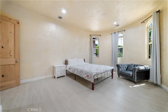 a view of a yard with plants and trees