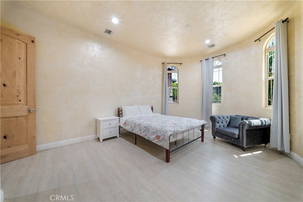 12605 Kagel Canyon Road Sylmar, CA 91342 - Photo 27 of 61 a bedroom with a bed and a couch