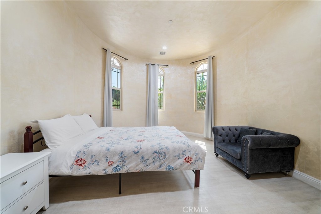 12605 Kagel Canyon Road Sylmar, CA 91342 - Photo 28 of 61 a bedroom with a bed and a couch