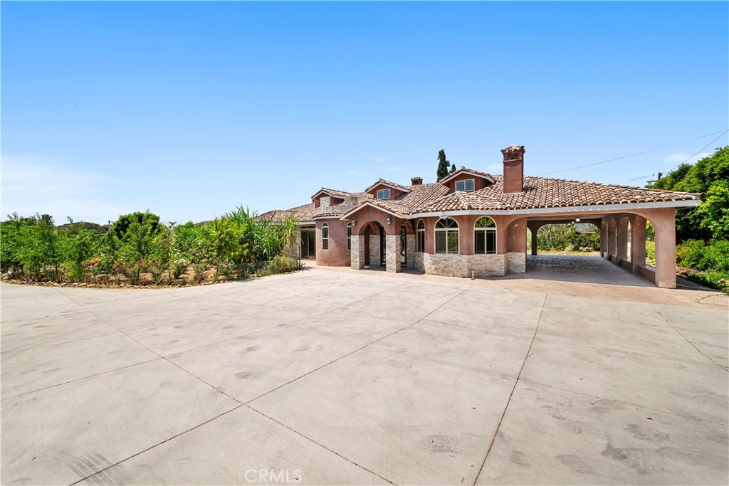 12605 Kagel Canyon Road Sylmar, CA 91342 - Photo 5 of 61 a front view of a house with a yard