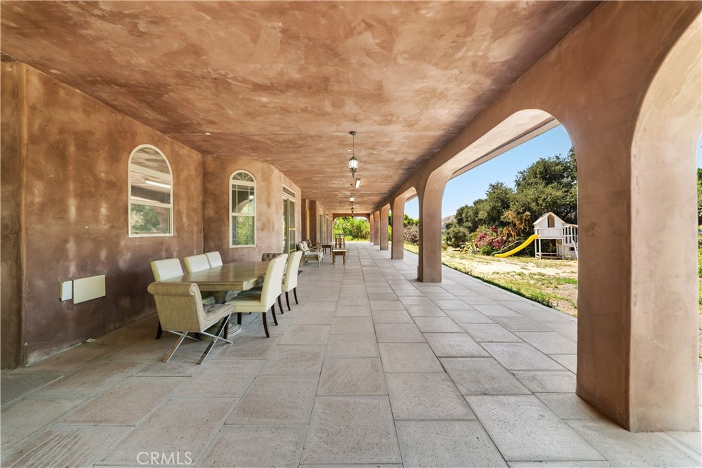 12605 Kagel Canyon Road Sylmar, CA 91342 - Photo 6 of 61 a view of a patio with a dining table and chairs with outer view
