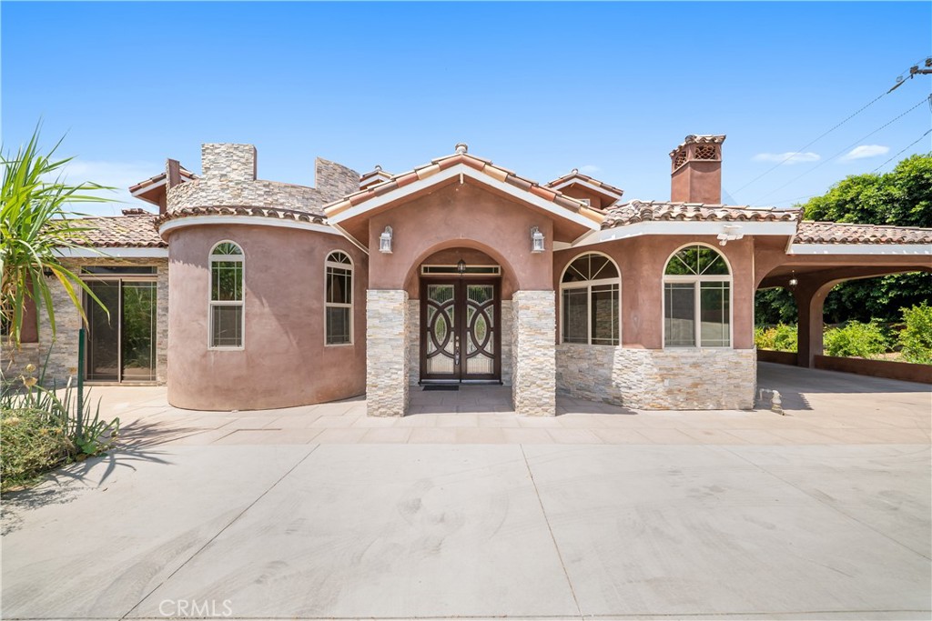 12605 Kagel Canyon Road Sylmar, CA 91342 - Photo 9 of 61 a front view of a house with a garden