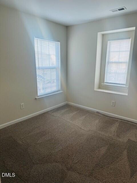 6005 Namozine Court Raleigh, NC 27610 - Photo 13 of 24 an empty room with windows