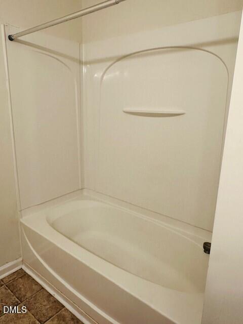 6005 Namozine Court Raleigh, NC 27610 - Photo 18 of 24 a bathroom with a shower and a bath tub