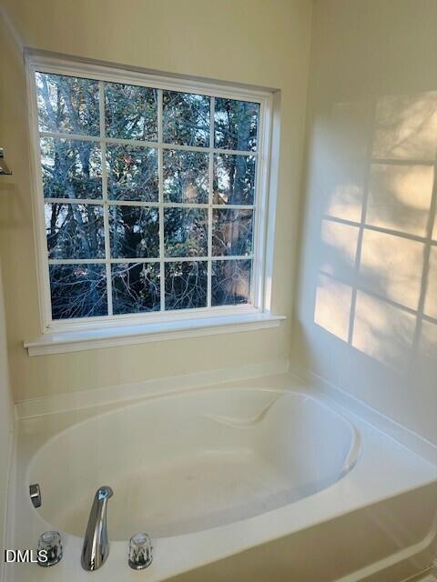 6005 Namozine Court Raleigh, NC 27610 - Photo 22 of 24 a bathroom with a bathtub