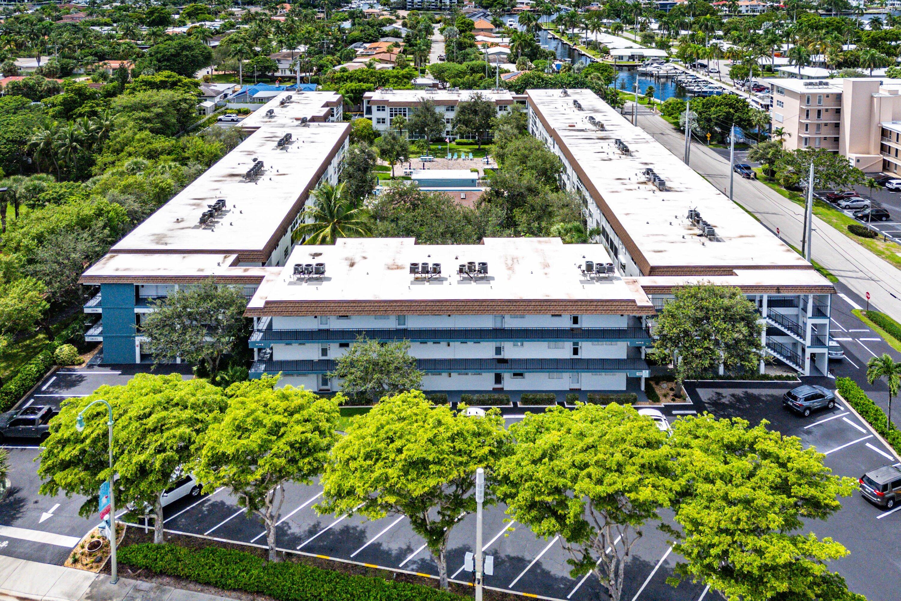 1501 South Ocean Boulevard, Unit 225 Lauderdale-by-the-Sea, FL 33062 - Photo 16 of 47 an aerial view of a house with a garden and plants