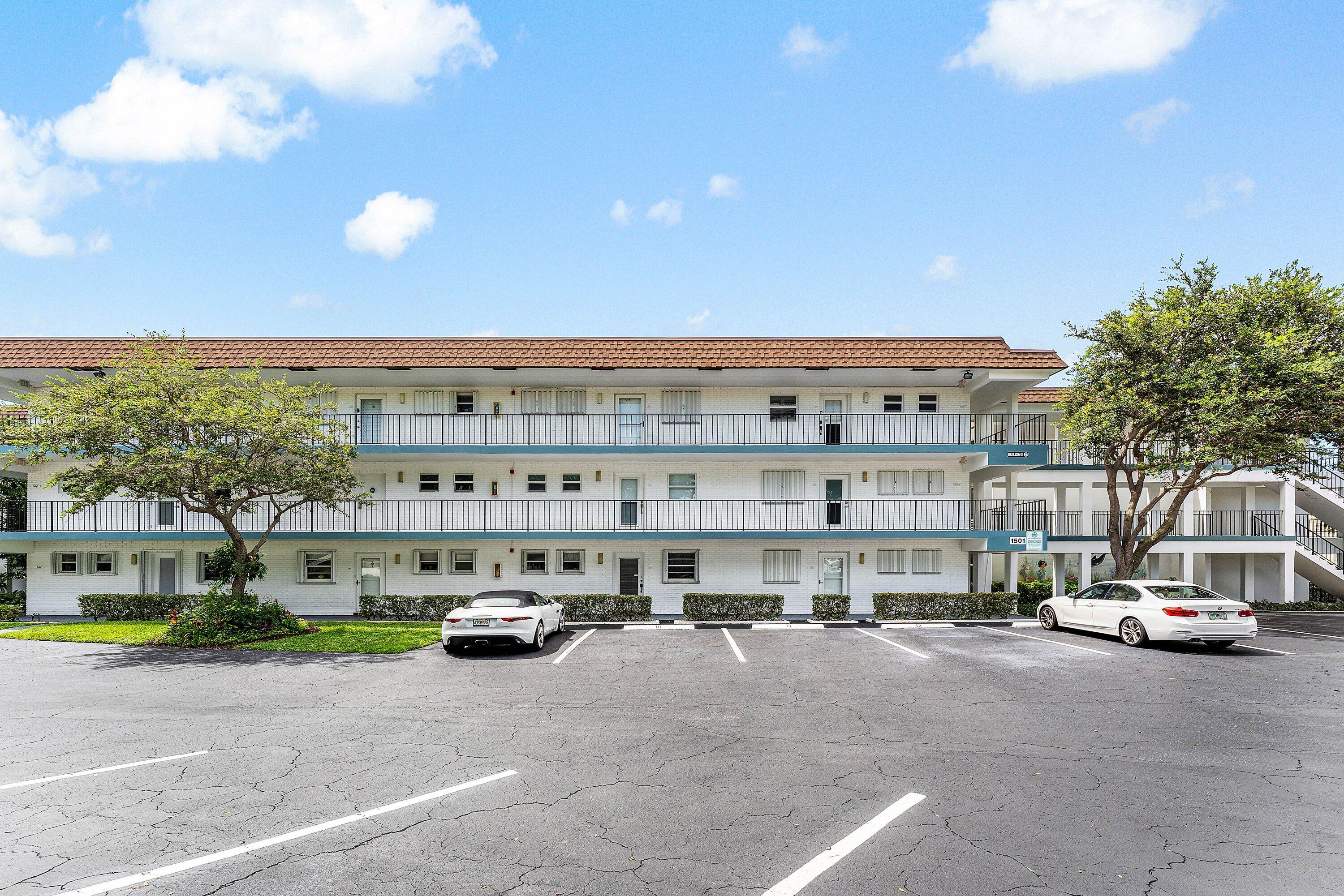 1501 South Ocean Boulevard, Unit 225 Lauderdale-by-the-Sea, FL 33062 - Photo 2 of 47 a view of building with cars park