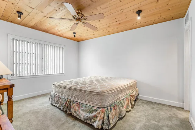 a view of an empty room with a fan