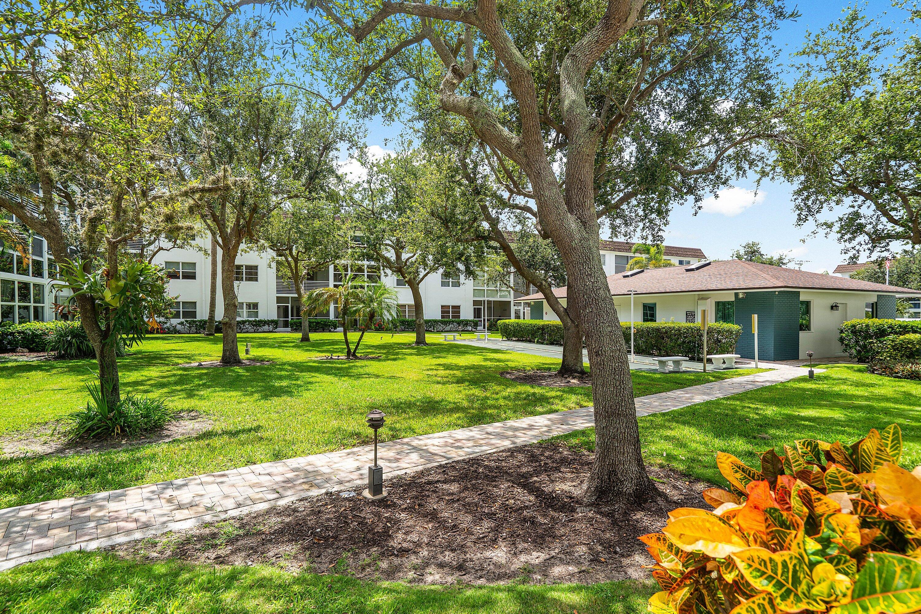 1501 South Ocean Boulevard, Unit 225 Lauderdale-by-the-Sea, FL 33062 - Photo 29 of 47 a view of a house with a yard