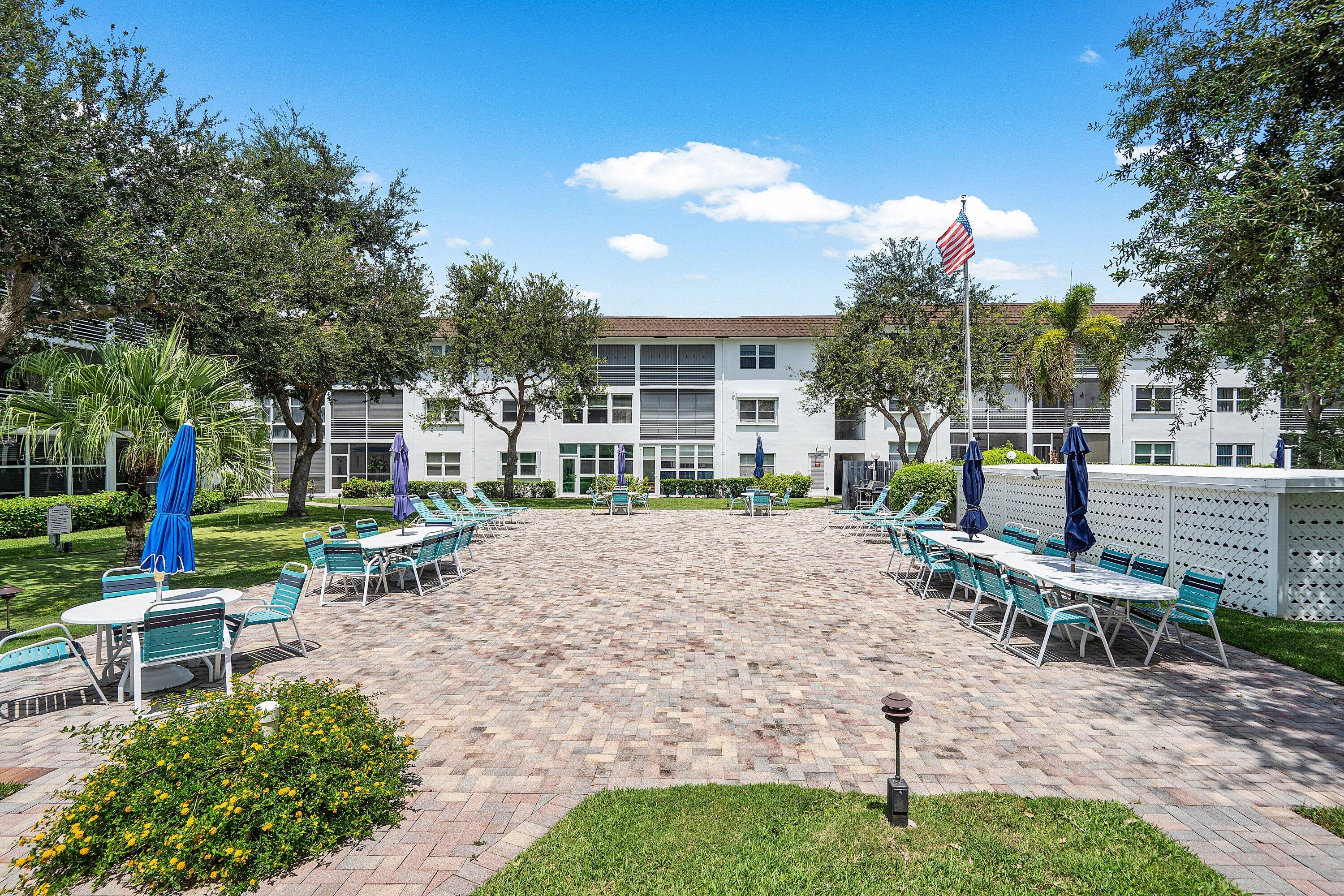 1501 South Ocean Boulevard, Unit 225 Lauderdale-by-the-Sea, FL 33062 - Photo 31 of 47 a view of a backyard with sitting area