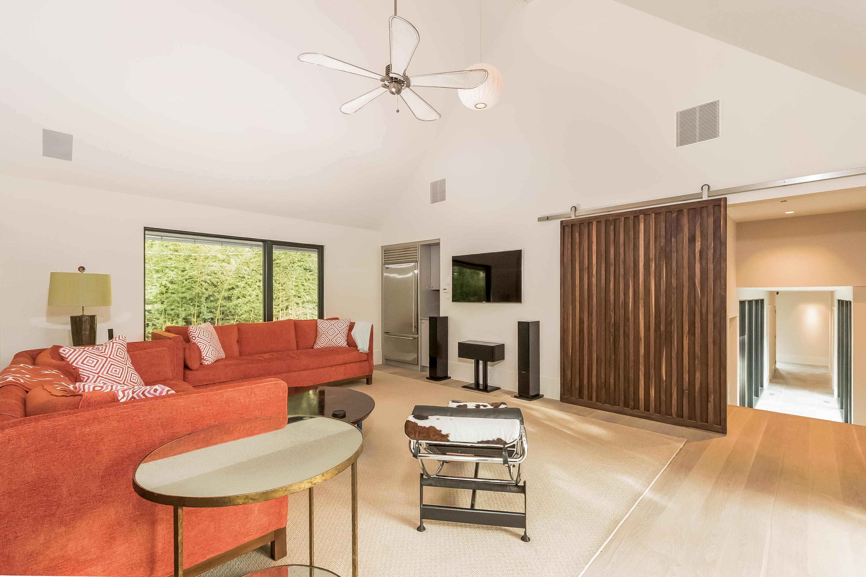 1 Beverly Place Darien, CT 06820 - Photo 17 of 45 a living room with furniture a large window and a flat screen tv