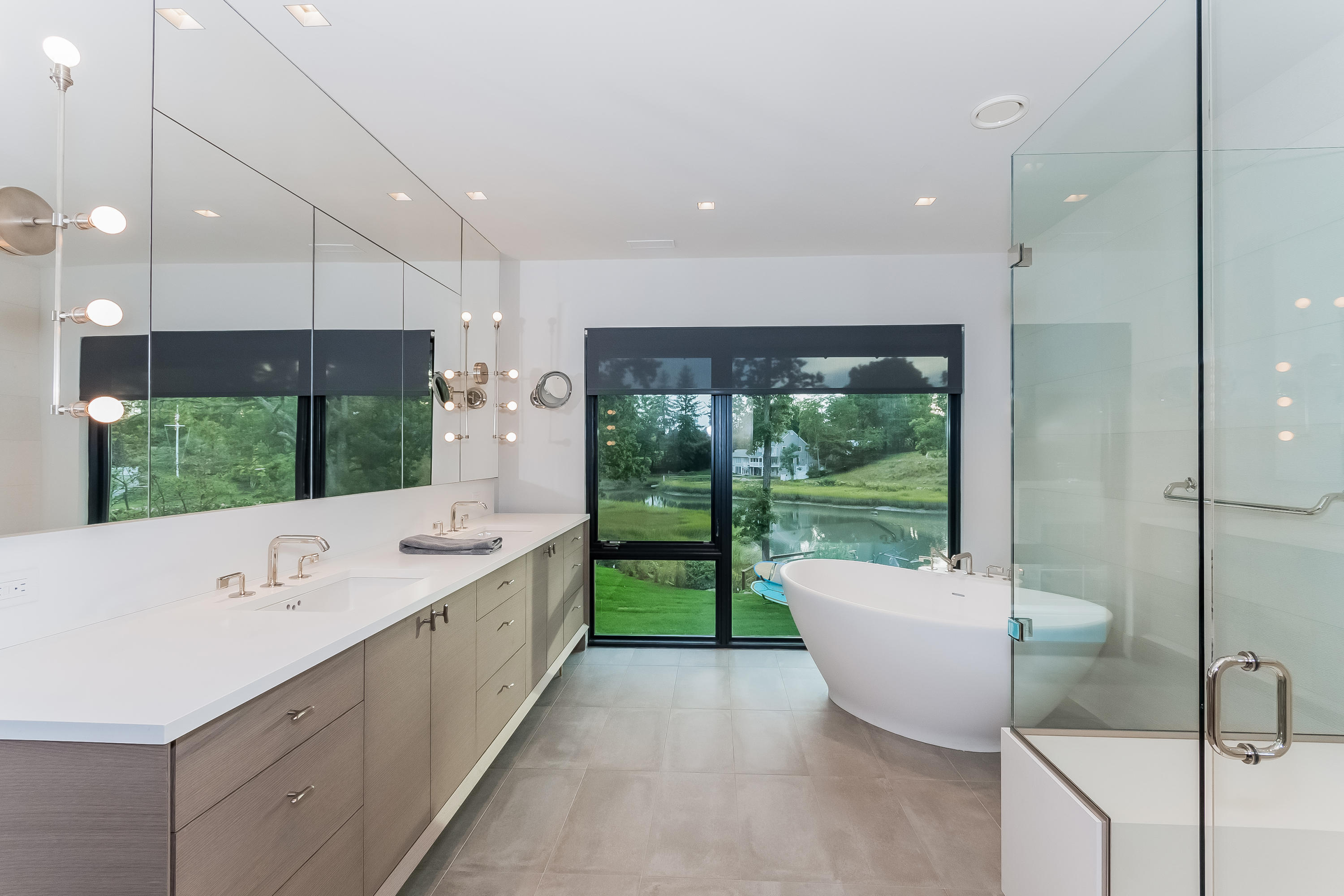 1 Beverly Place Darien, CT 06820 - Photo 21 of 45 a large bathroom with a tub mirror and window