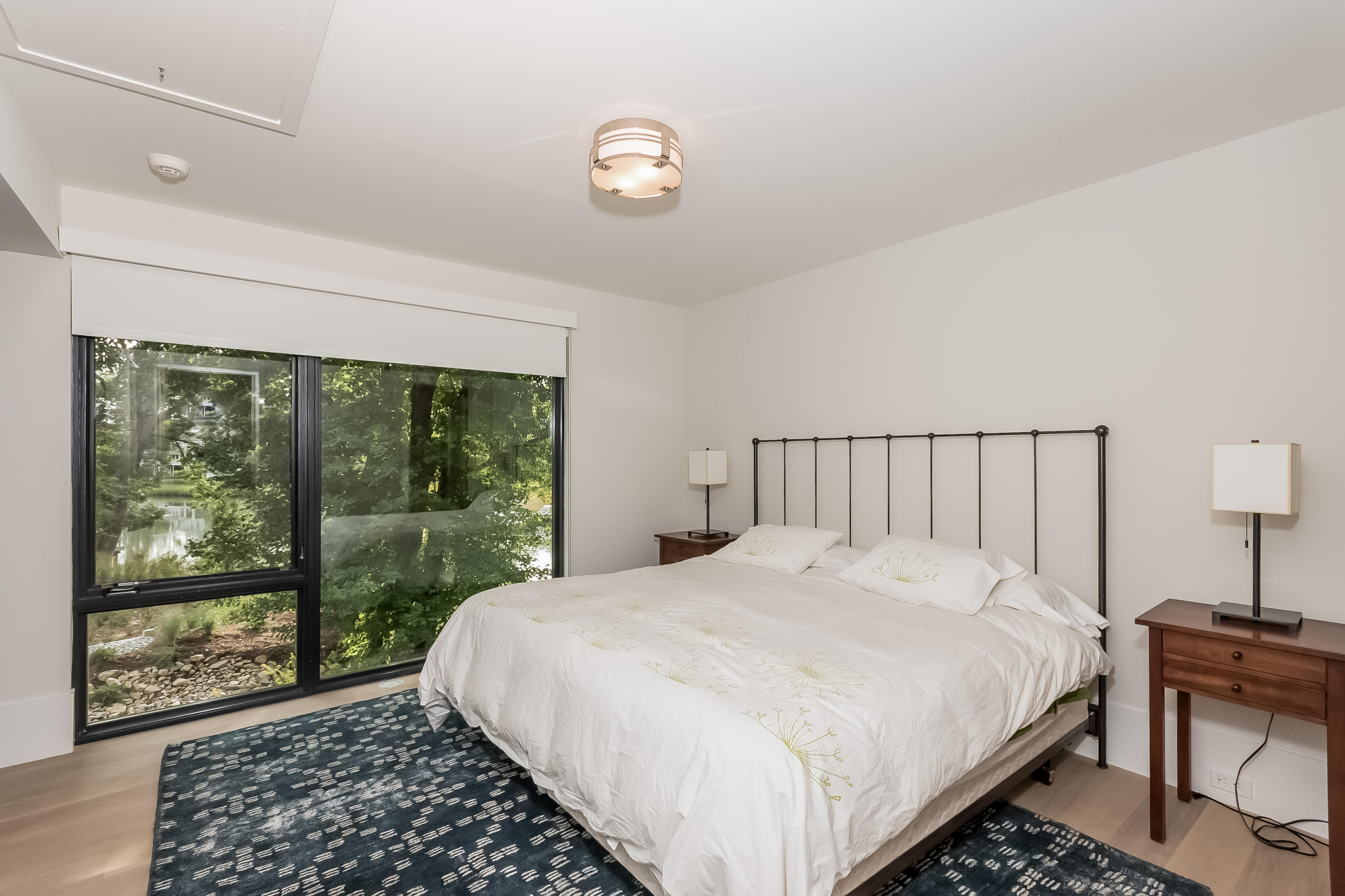 1 Beverly Place Darien, CT 06820 - Photo 25 of 45 a large bed sitting in a bedroom next to a window