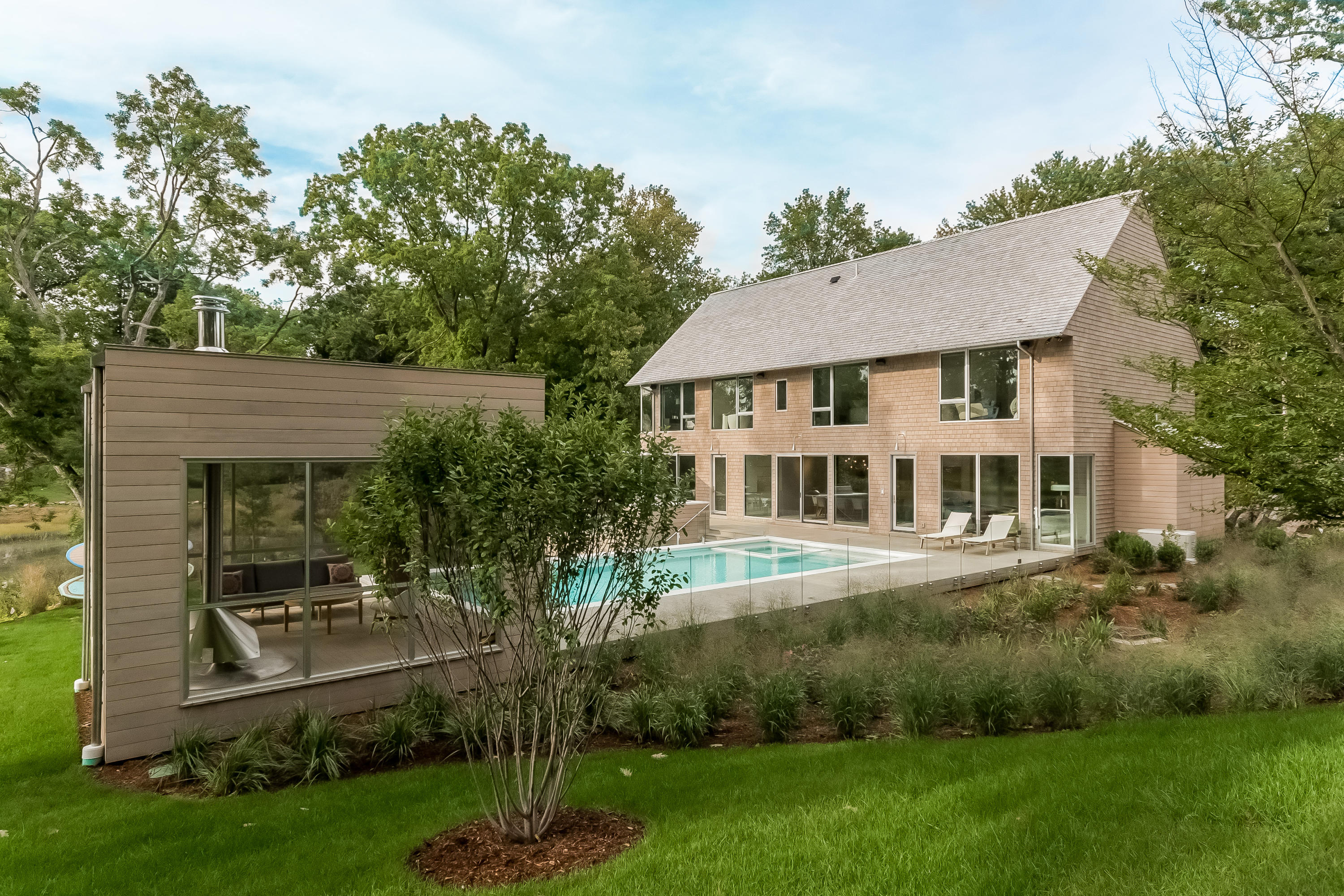 1 Beverly Place Darien, CT 06820 - Photo 4 of 45 a front view of a house with a yard