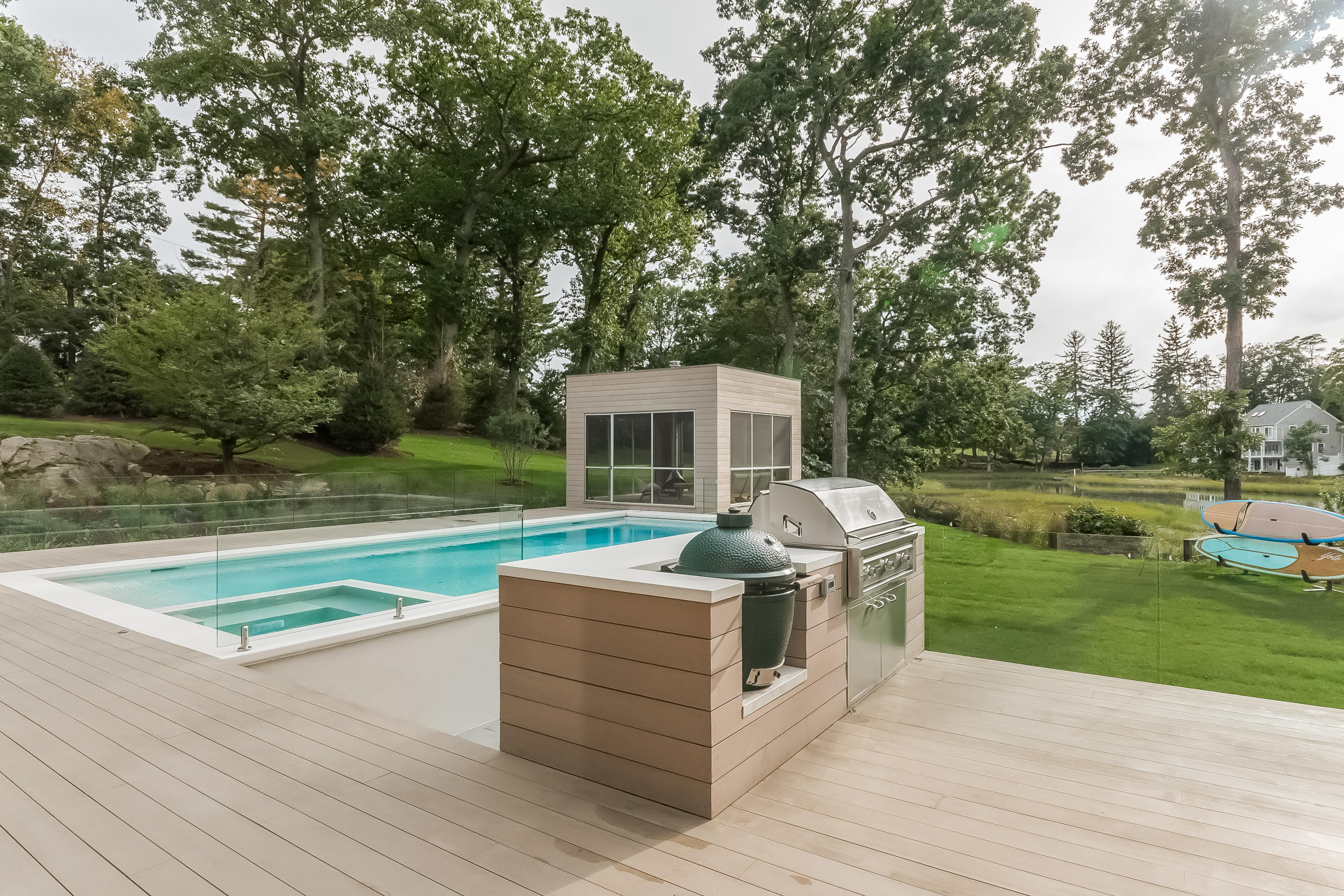 1 Beverly Place Darien, CT 06820 - Photo 35 of 45 a view of a deck with couches and wooden floor next to a yard