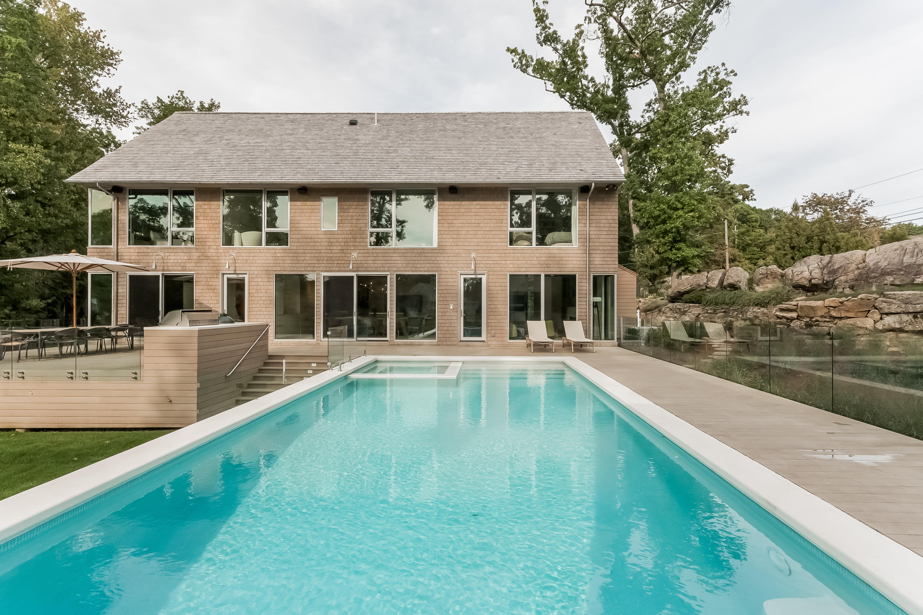 1 Beverly Place Darien, CT 06820 - Photo 36 of 45 a view of a house with swimming pool