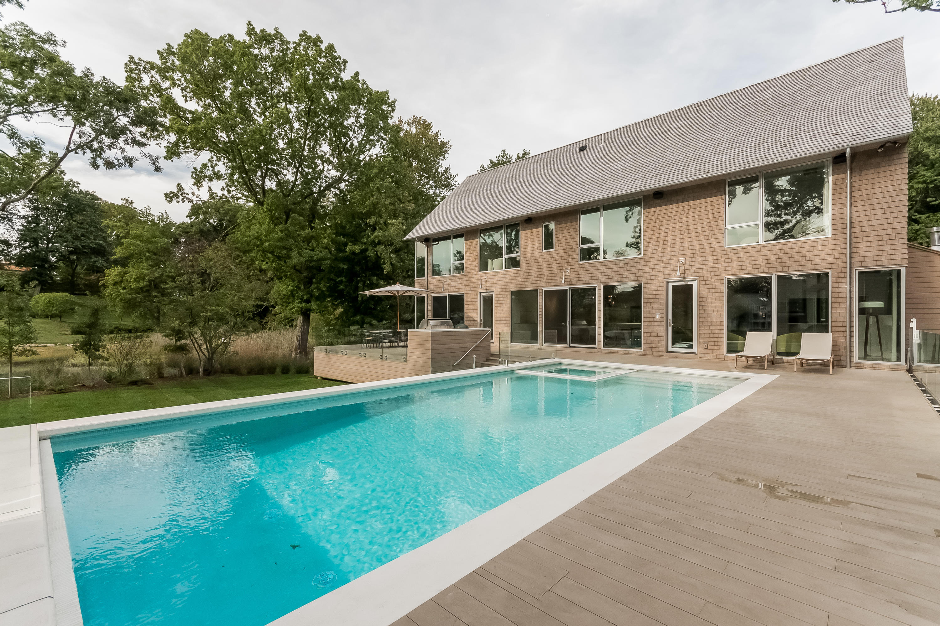 1 Beverly Place Darien, CT 06820 - Photo 5 of 45 a view of a house with swimming pool