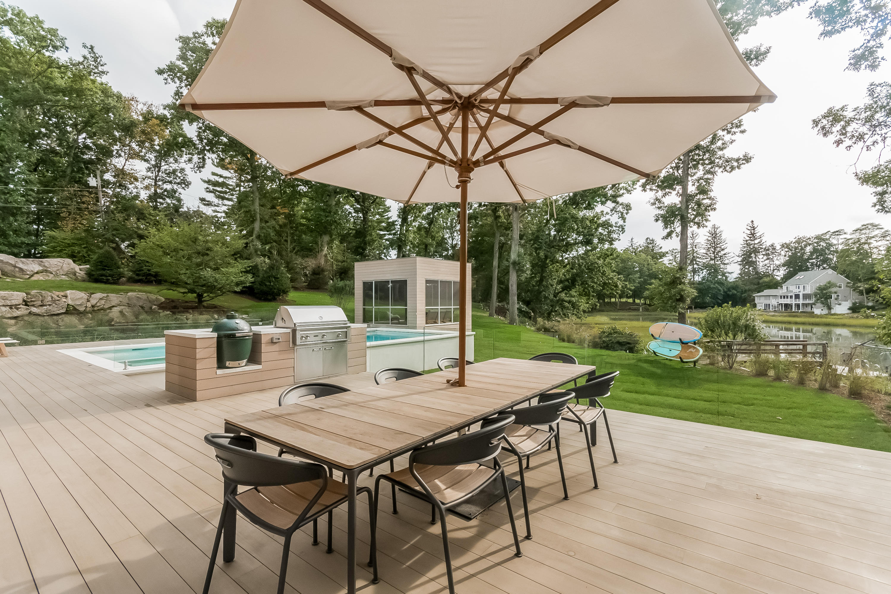 1 Beverly Place Darien, CT 06820 - Photo 8 of 45 a view of a patio with table and chairs under an umbrella