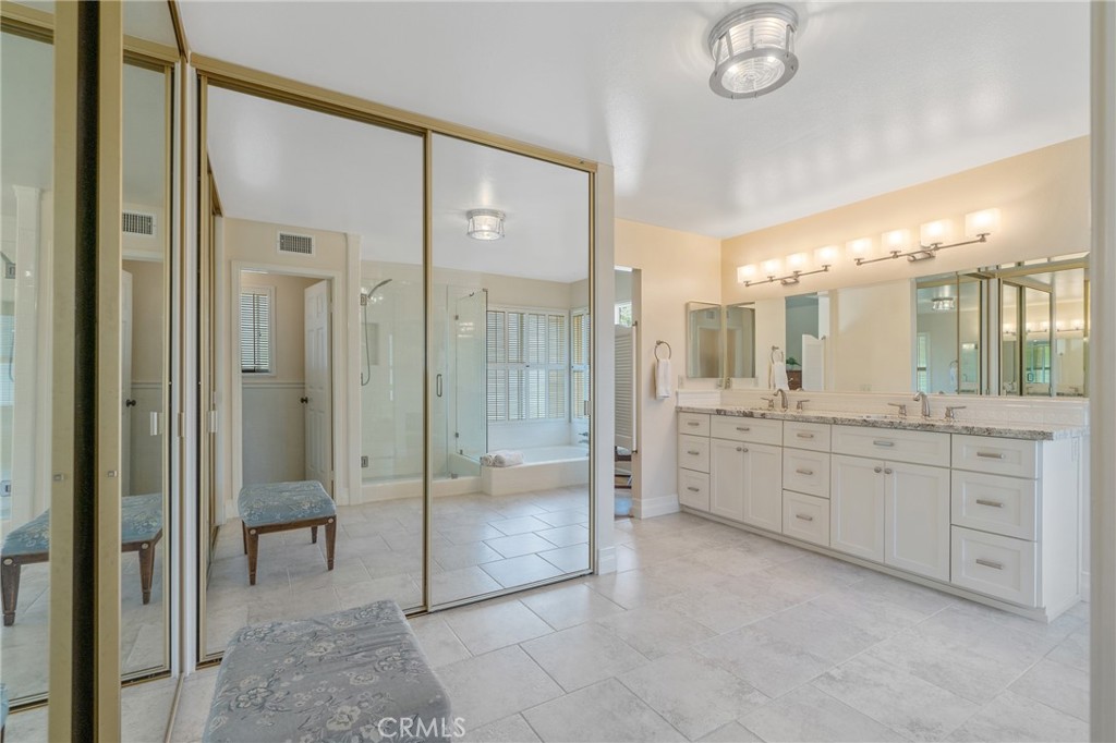 11422 Ridgegate Drive Whittier, CA 90601 - Photo 12 of 18 a bathroom with a granite countertop sink a toilet and a shower