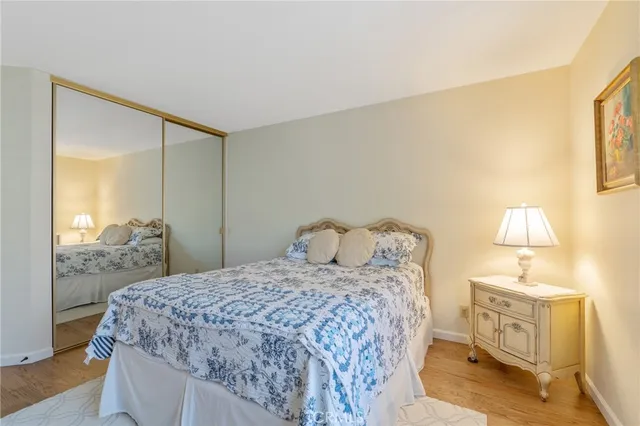 a bedroom with a bed and a lamp