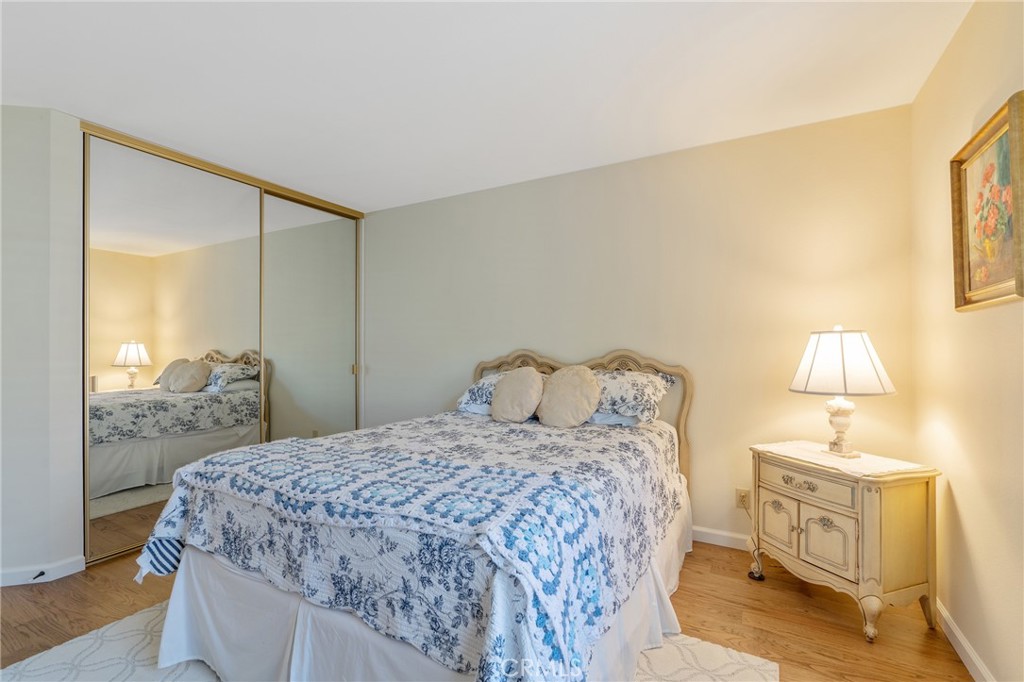 11422 Ridgegate Drive Whittier, CA 90601 - Photo 14 of 18 a bedroom with a bed and a lamp