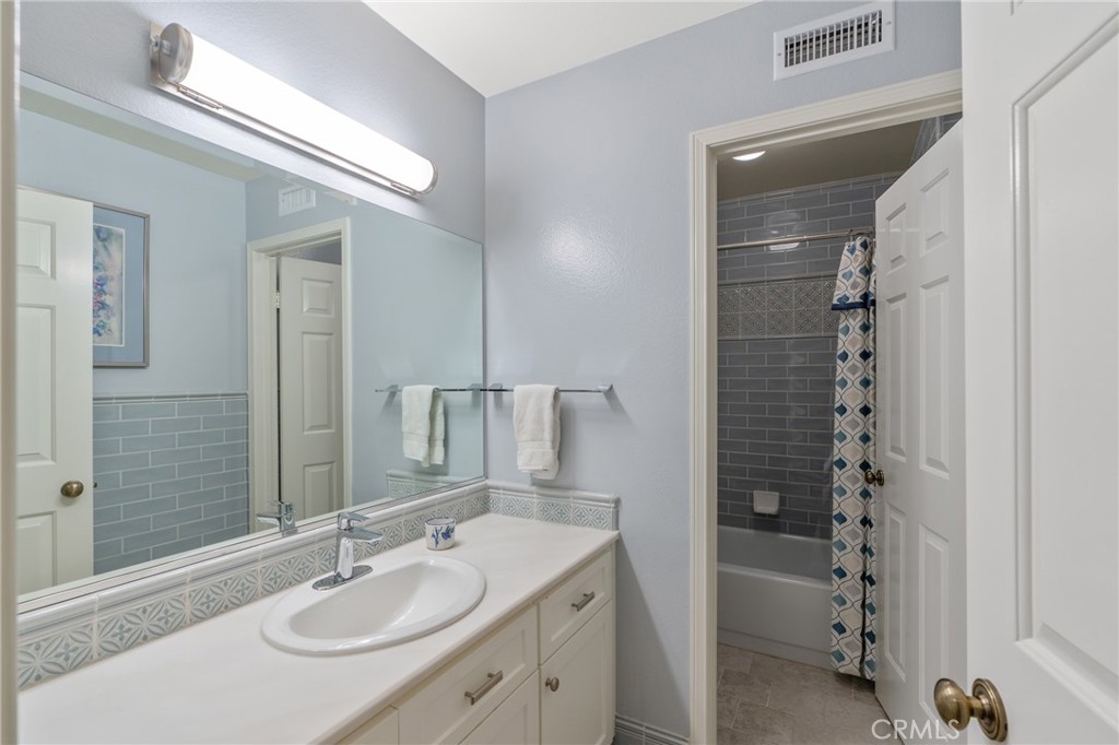 11422 Ridgegate Drive Whittier, CA 90601 - Photo 15 of 18 a bathroom with a sink double vanity and shower