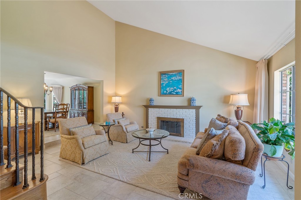11422 Ridgegate Drive Whittier, CA 90601 - Photo 3 of 18 a living room with furniture and a fireplace
