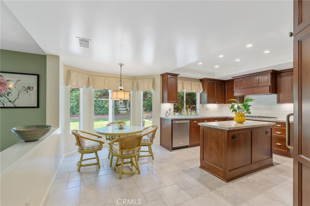 11422 Ridgegate Drive Whittier, CA 90601 - Photo 5 of 18 a kitchen with kitchen island granite countertop lots of counter top space and stainless steel appliances