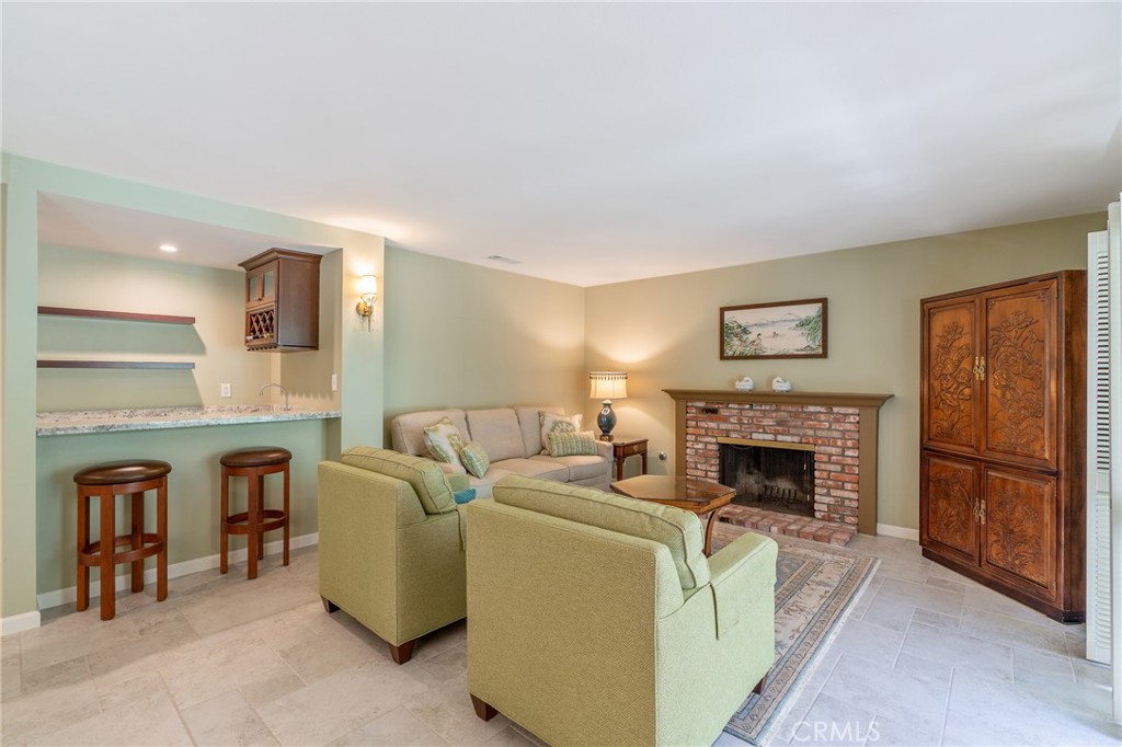 11422 Ridgegate Drive Whittier, CA 90601 - Photo 9 of 18 a living room with furniture and a fireplace