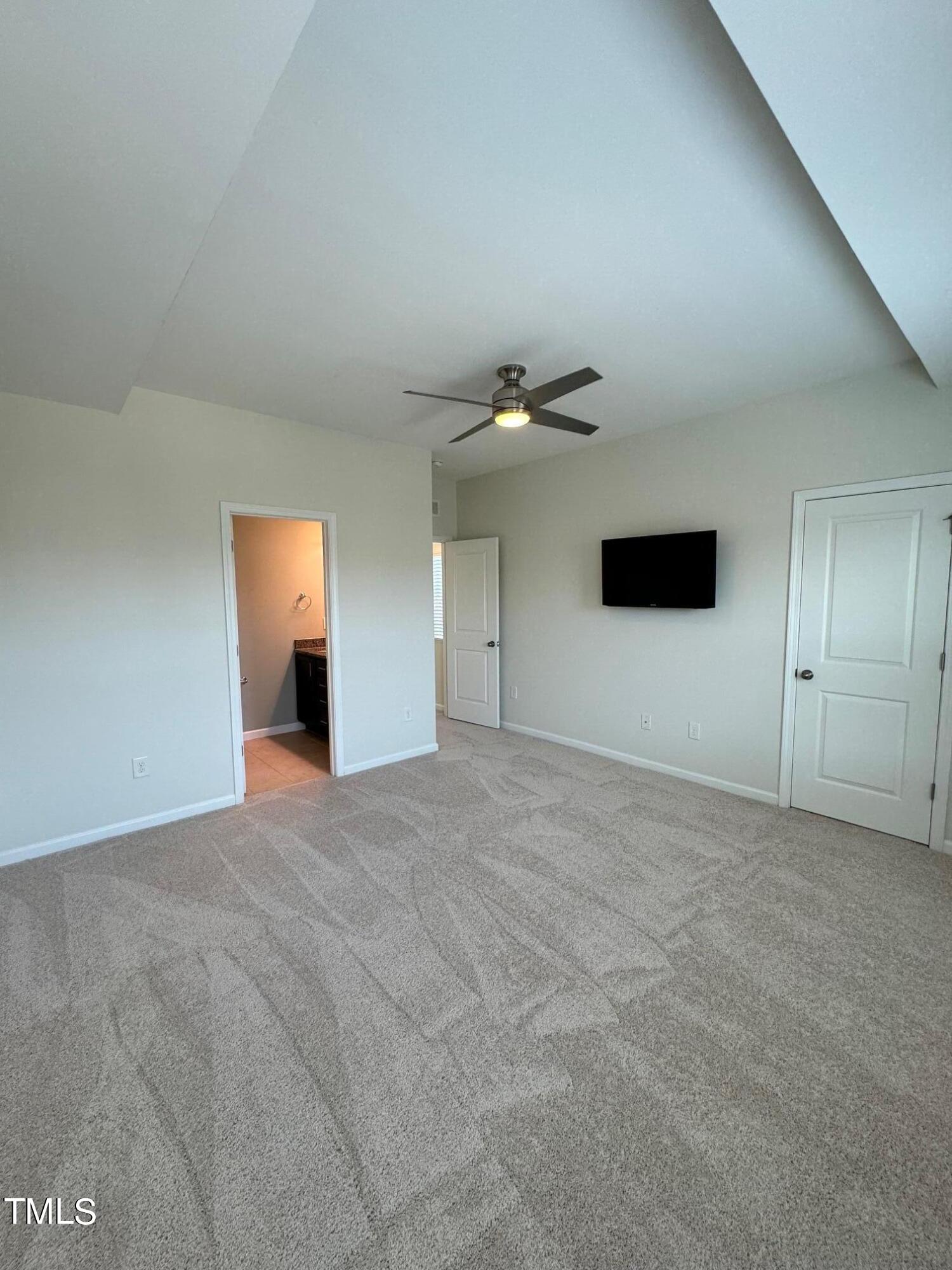 1571 Rodessa Run Raleigh, NC 27607 - Photo 14 of 25 a view of an empty room with a chandelier fan
