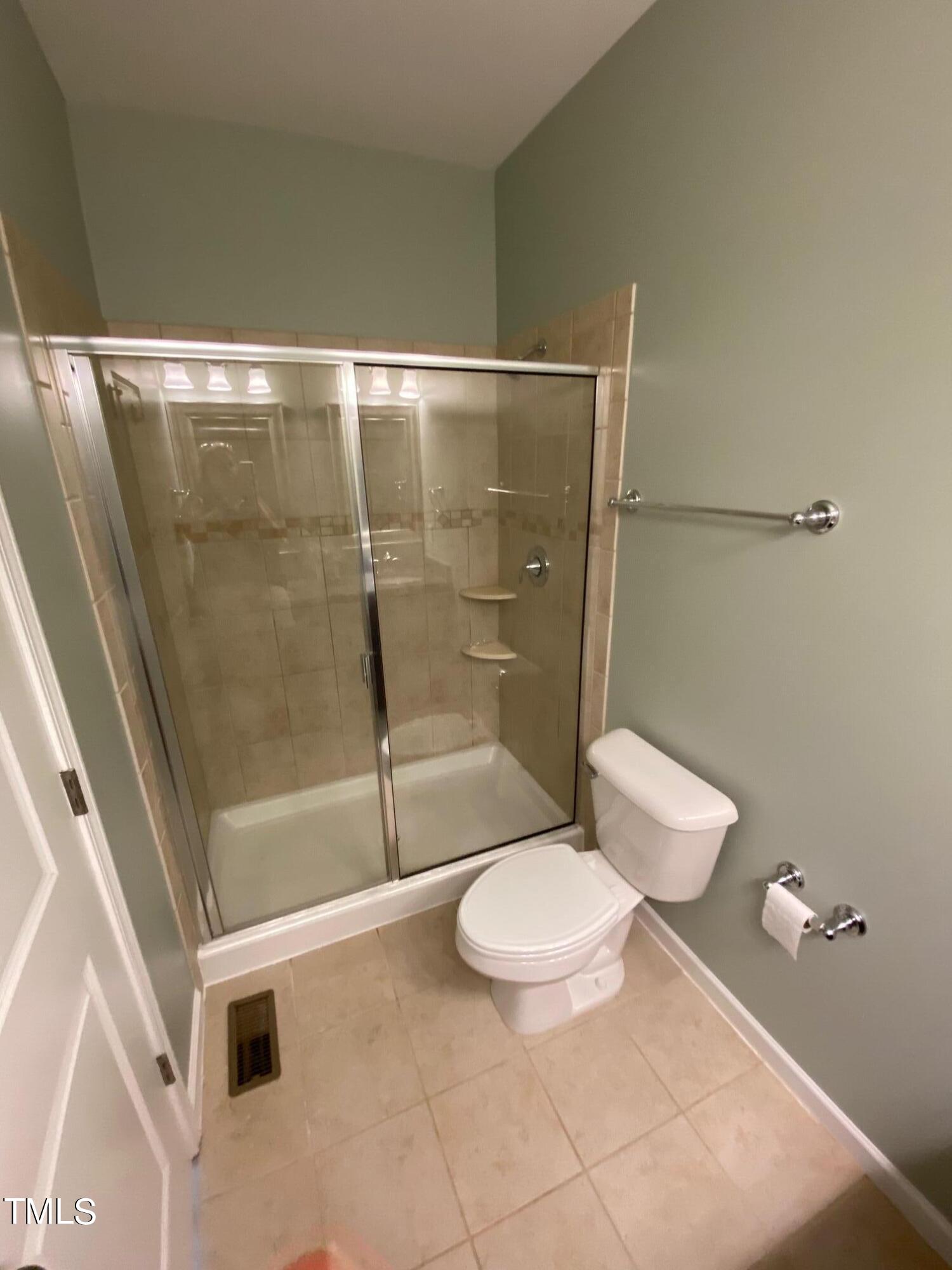 1571 Rodessa Run Raleigh, NC 27607 - Photo 18 of 25 a bathroom with a toilet and a shower
