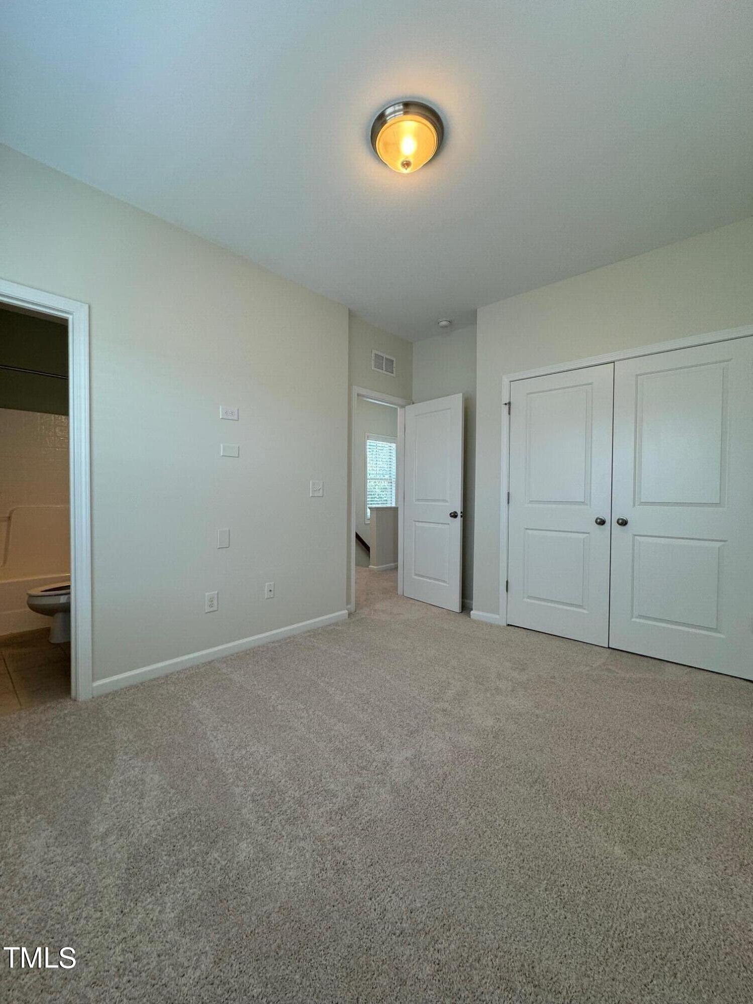 1571 Rodessa Run Raleigh, NC 27607 - Photo 19 of 25 an empty room with a natural light