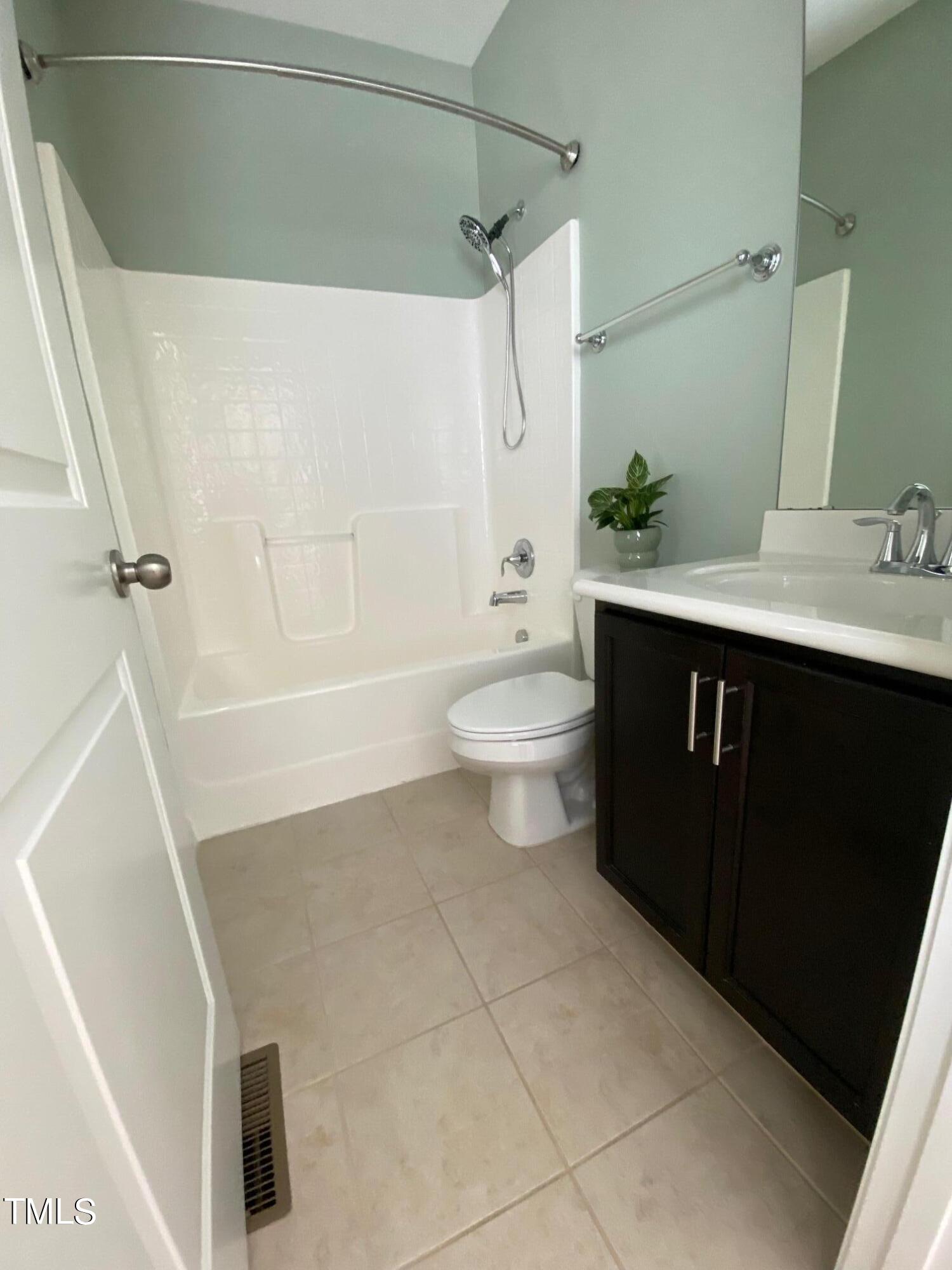 1571 Rodessa Run Raleigh, NC 27607 - Photo 20 of 25 a bathroom with a sink a toilet and shower