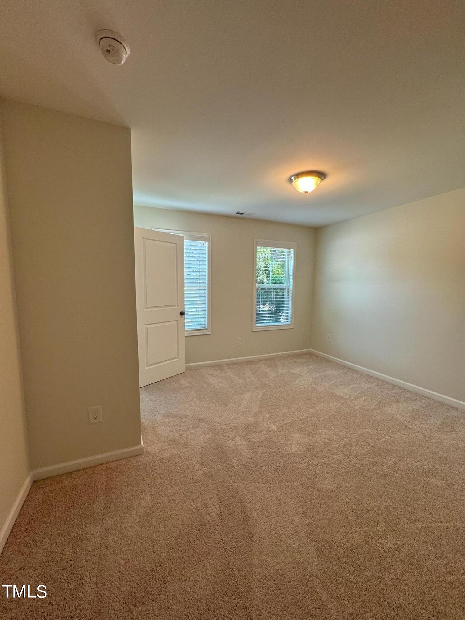 1571 Rodessa Run Raleigh, NC 27607 - Photo 23 of 25 an empty room with windows
