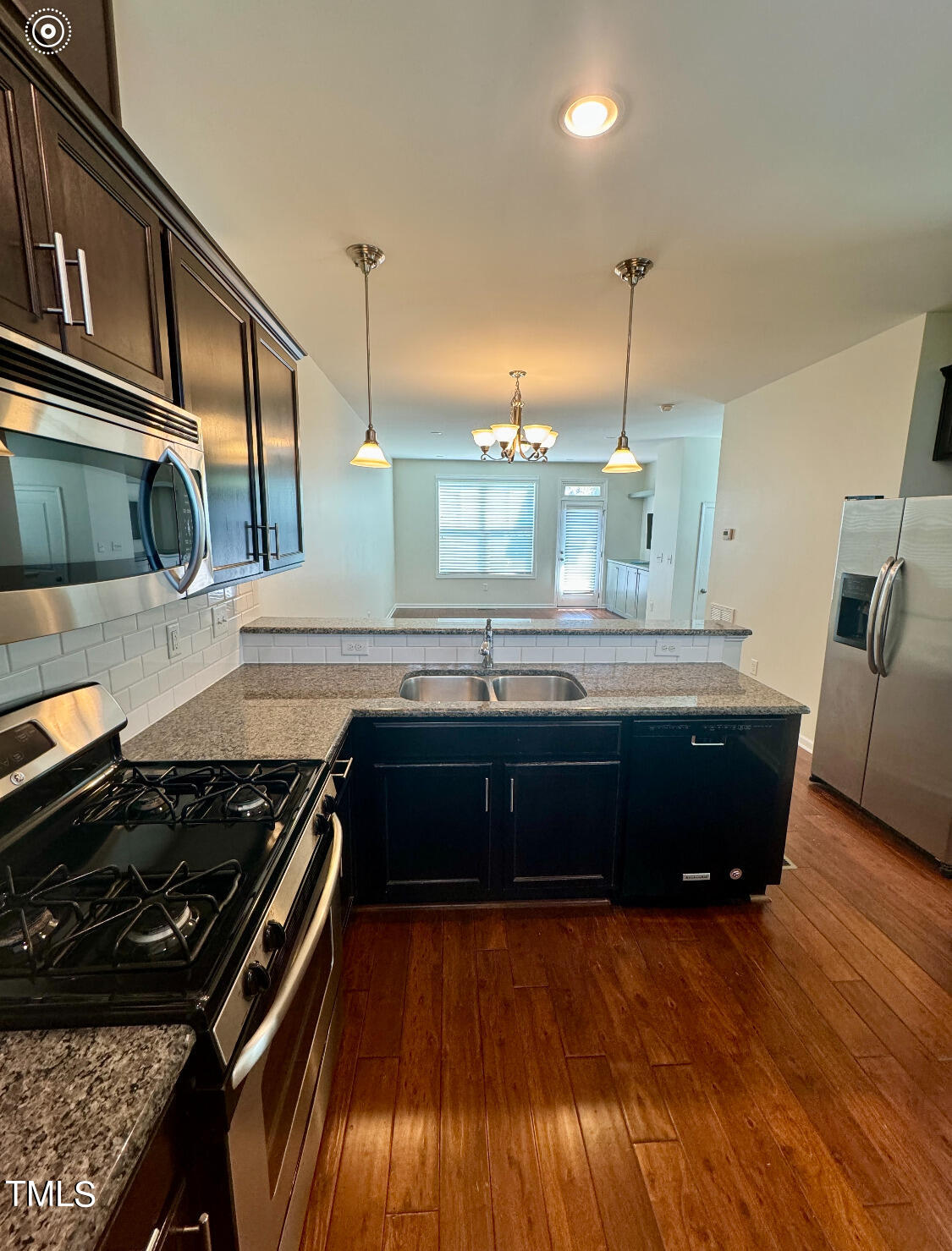 1571 Rodessa Run Raleigh, NC 27607 - Photo 6 of 25 a kitchen with a stove and a wooden floors