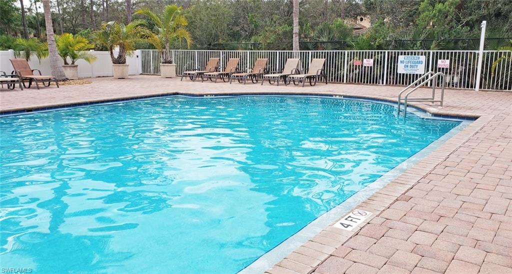 3530 Lansing Loop, Unit 202 Estero, FL 33928 - Photo 34 of 35 a view of a swimming pool with a patio