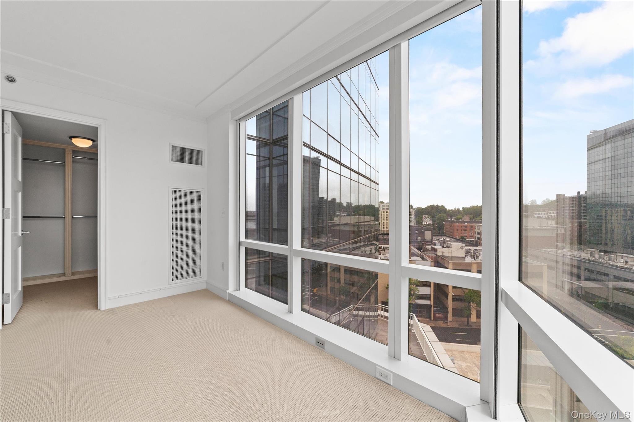 5 Renaissance Square, Unit 10G White Plains, NY 10601 - Photo 18 of 28 a view of an empty room and window