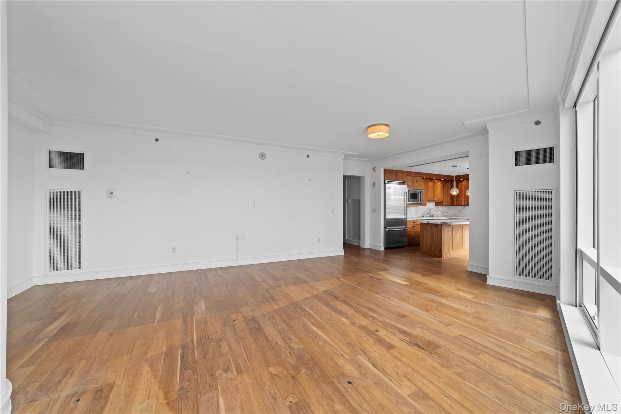 5 Renaissance Square, Unit 10G White Plains, NY 10601 - Photo 6 of 28 a view of a livingroom with wooden floor
