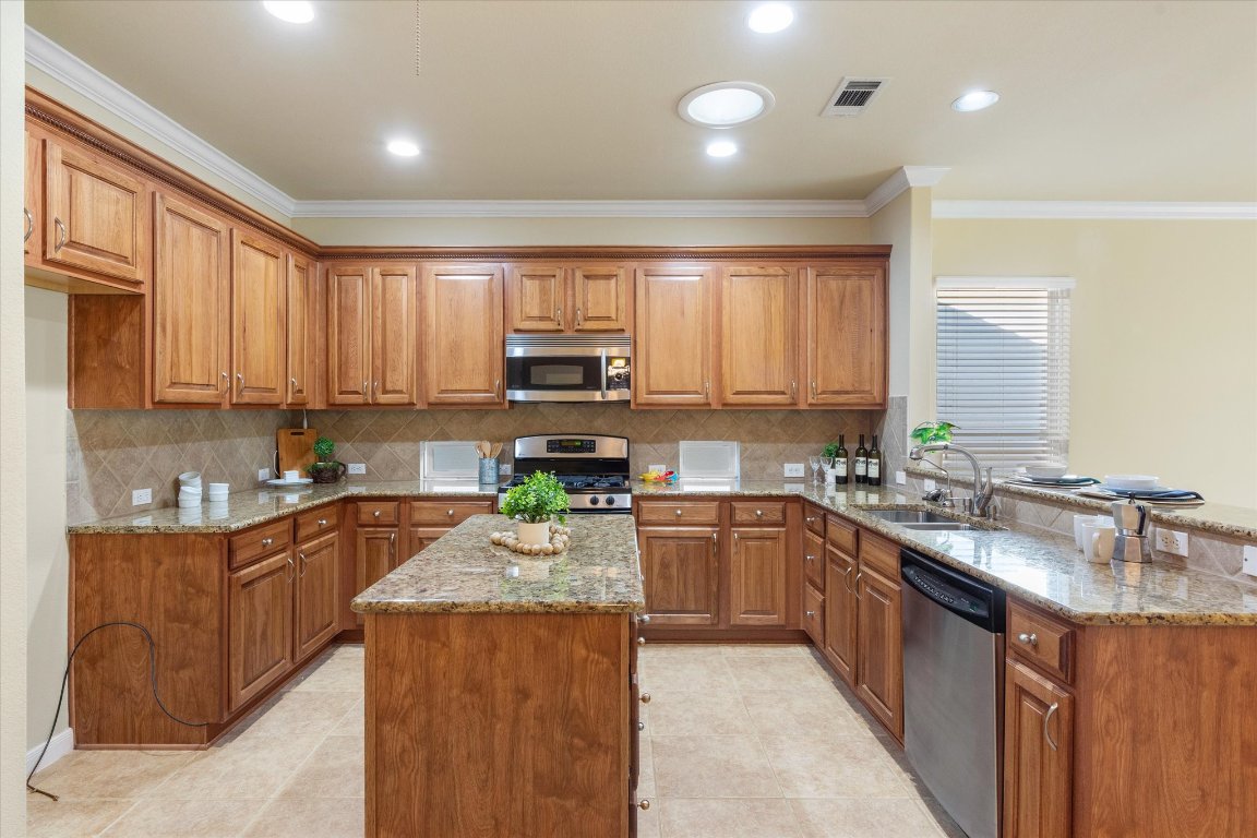 531 Deer Meadow Circle Georgetown, TX 78633 - Photo 16 of 39 Granite counters, stainless steel appliances and island