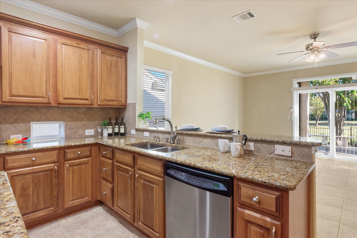 531 Deer Meadow Circle Georgetown, TX 78633 - Photo 17 of 39 View from the kitchen over the bar into living room