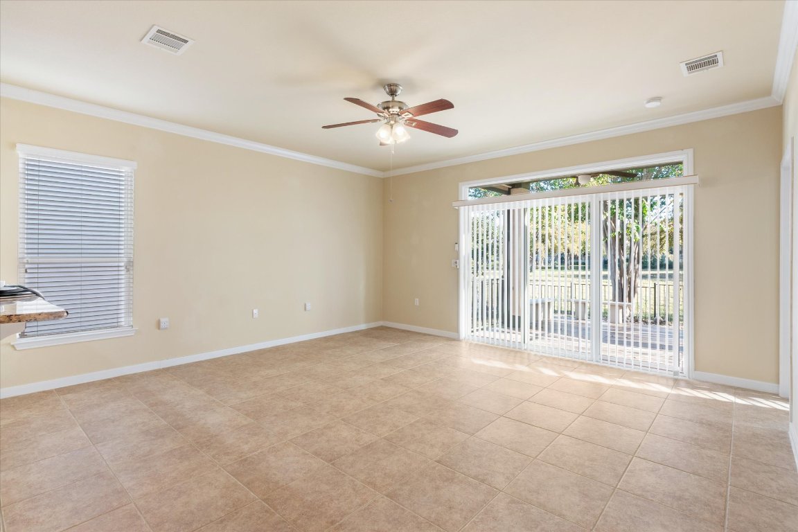 531 Deer Meadow Circle Georgetown, TX 78633 - Photo 21 of 39 Nice sliders off the living room looking onto the oversized shared green space out back.
