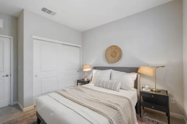 a bedroom with a bed and window