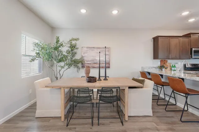 a kitchen with kitchen island granite countertop stainless steel appliances and sink