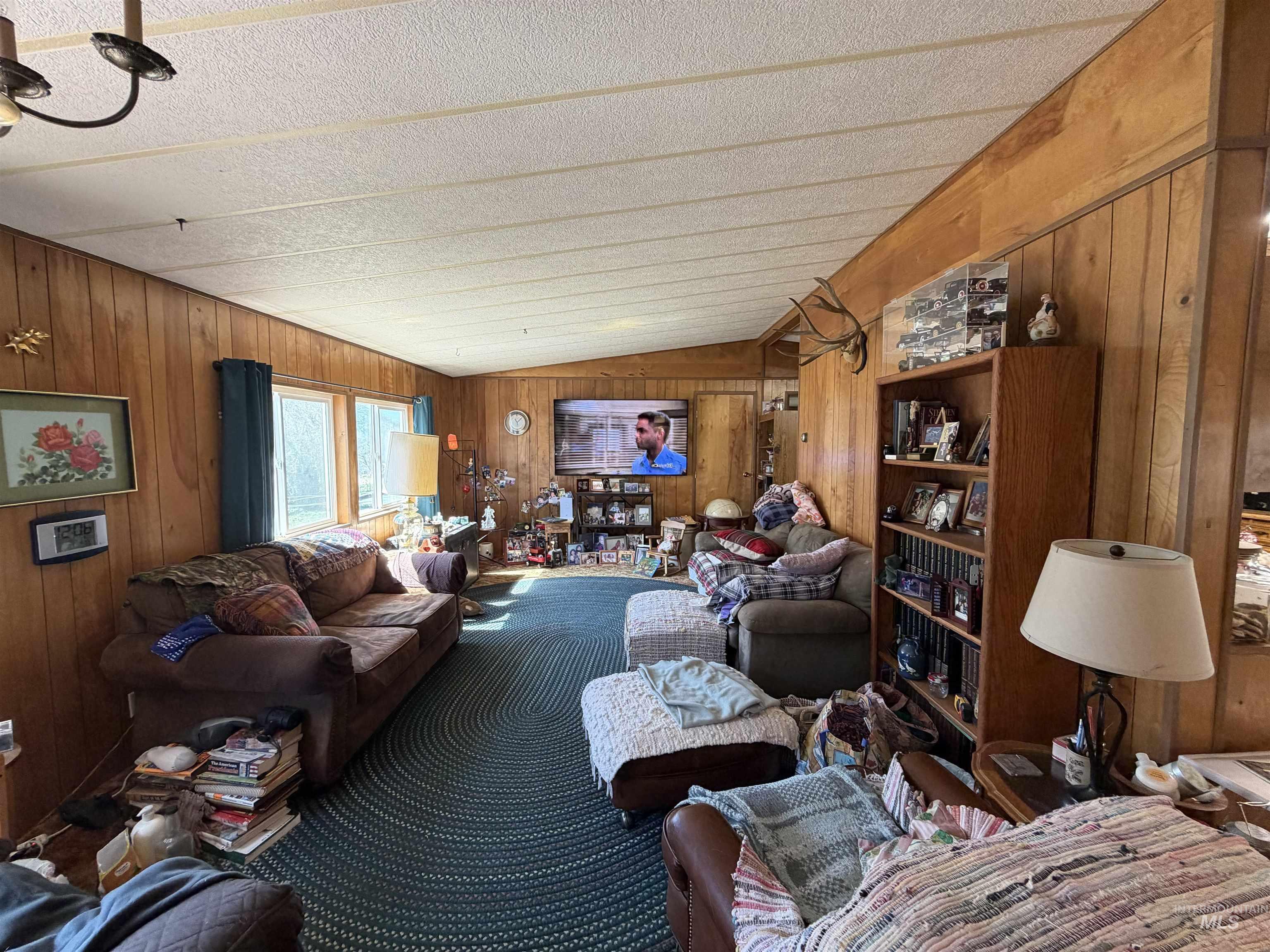 27474 North Tom Beall Road Lapwai, ID 83540 - Photo 45 of 50 Living area featuring wooden walls