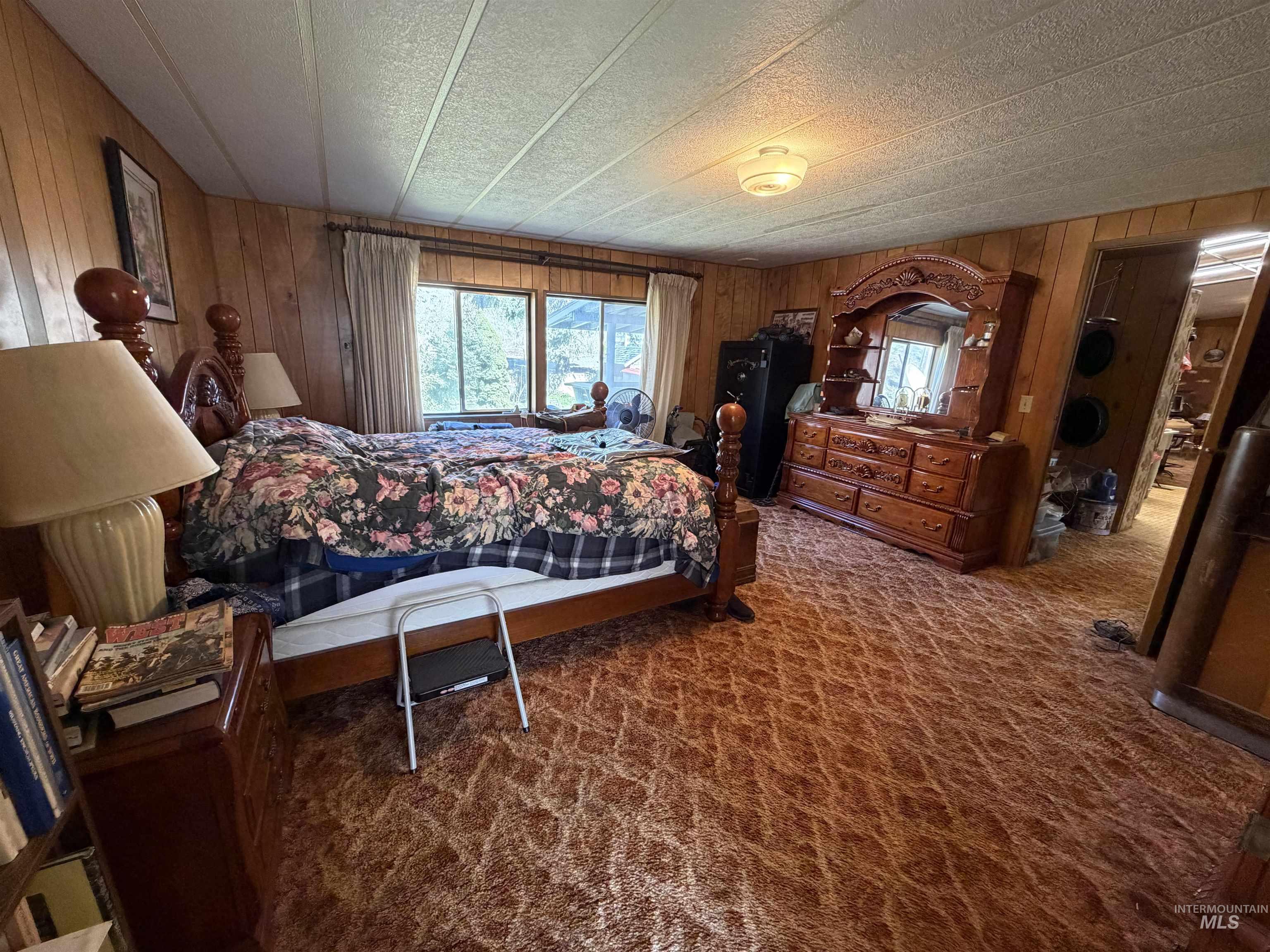 27474 North Tom Beall Road Lapwai, ID 83540 - Photo 49 of 50 Bedroom featuring dark colored carpet and wood walls