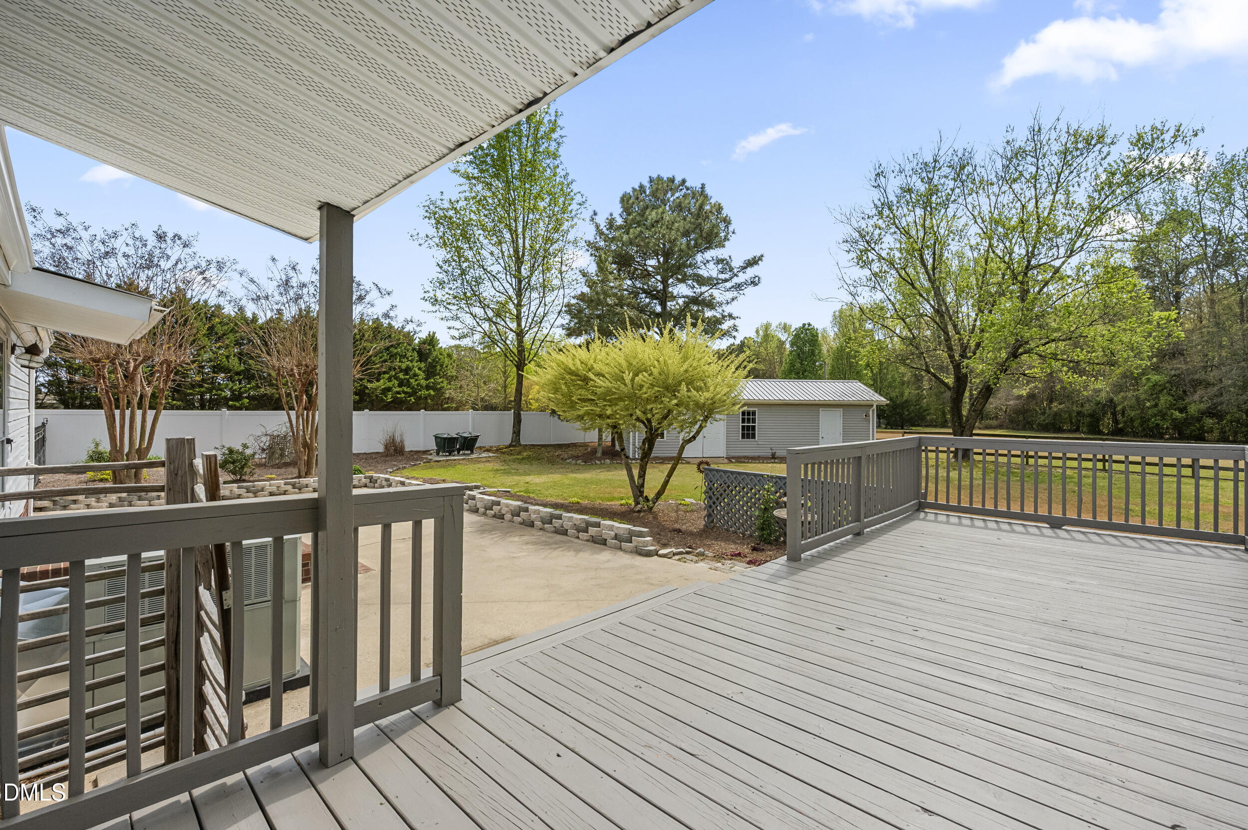 221 Pinkney Church Road Fremont, NC 27830 - Photo 28 of 36 a view of a deck with trees in the background
