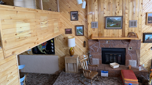 358 South Sky Drive Torrey, UT 84775 - Photo 33 of 82 Stone-surround fireplace with a wood mantle